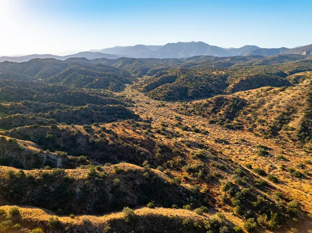 an aerial view of residential house and car parked
