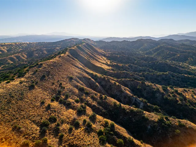 an aerial view of residential building and ocean view
