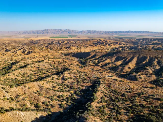 an aerial view of residential building and ocean view