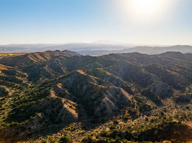 an aerial view of residential house and green space