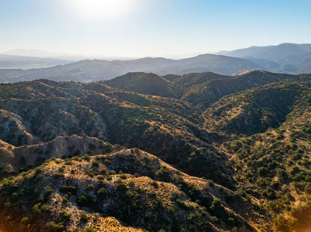 a view of a city with mountains in the background