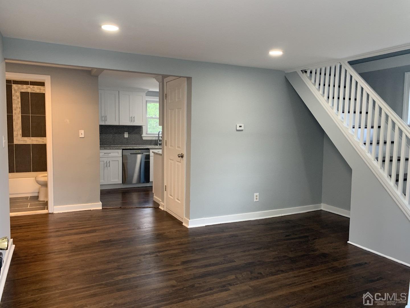 180 East Cliff Road Colonia, NJ 07067 - Photo 2 of 6 a view of kitchen with wooden floor electronic appliances and stairs