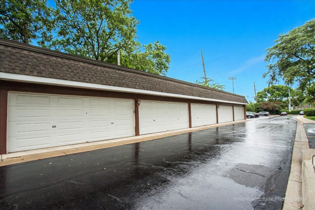 4224 Saratoga Avenue, Unit J105 Downers Grove, IL 60515 - Photo 20 of 20 a view of backyard and garage