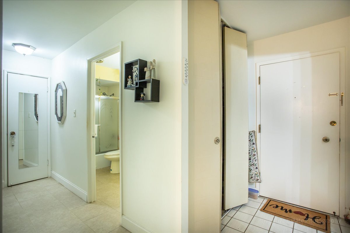 4224 Saratoga Avenue, Unit J105 Downers Grove, IL 60515 - Photo 2 of 20 a view of a bathroom from a hallway