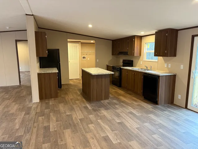 a view of a kitchen with a sink