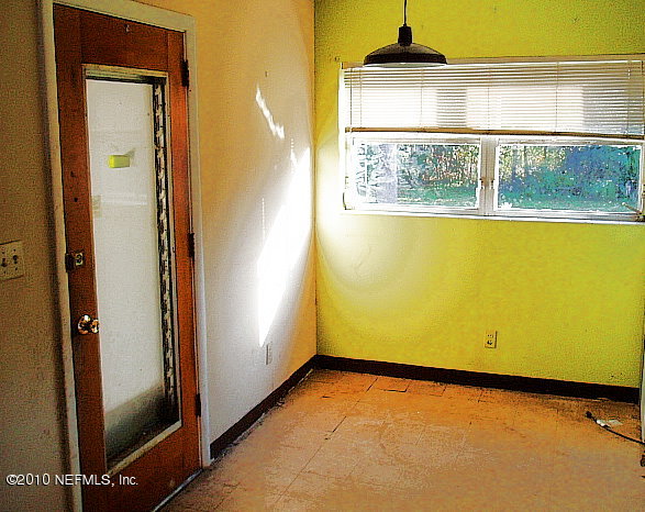 3211 Kline Road Jacksonville, FL 32246 - Photo 3 of 10 an empty room with a window