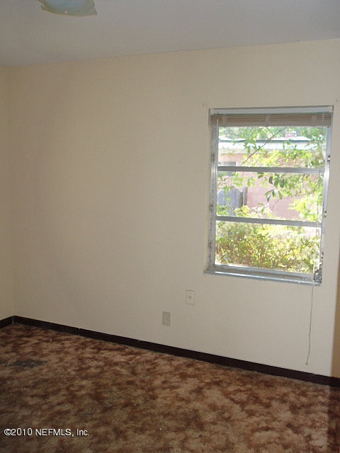3211 Kline Road Jacksonville, FL 32246 - Photo 5 of 10 a view of an empty room and window