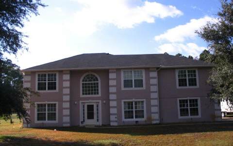 55397 Bear Run Road Callahan, FL 32011 - Photo 1 of 1 a front view of a house with a yard