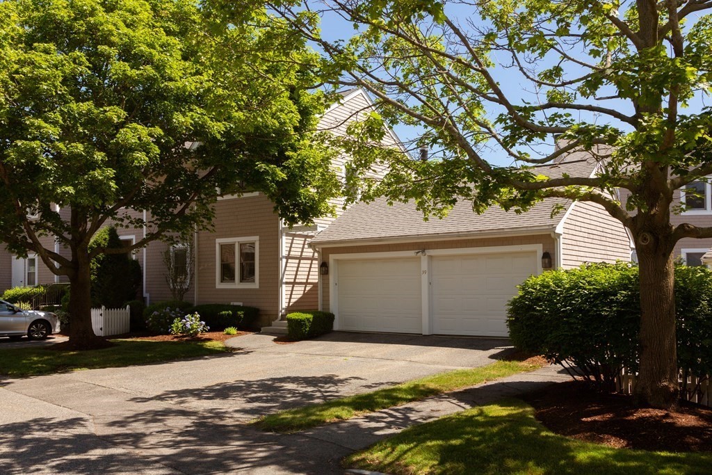 39 Harbourside Road, Unit 44 Quincy, MA 02171 - Photo 1 of 21 a house with a tree in front of it