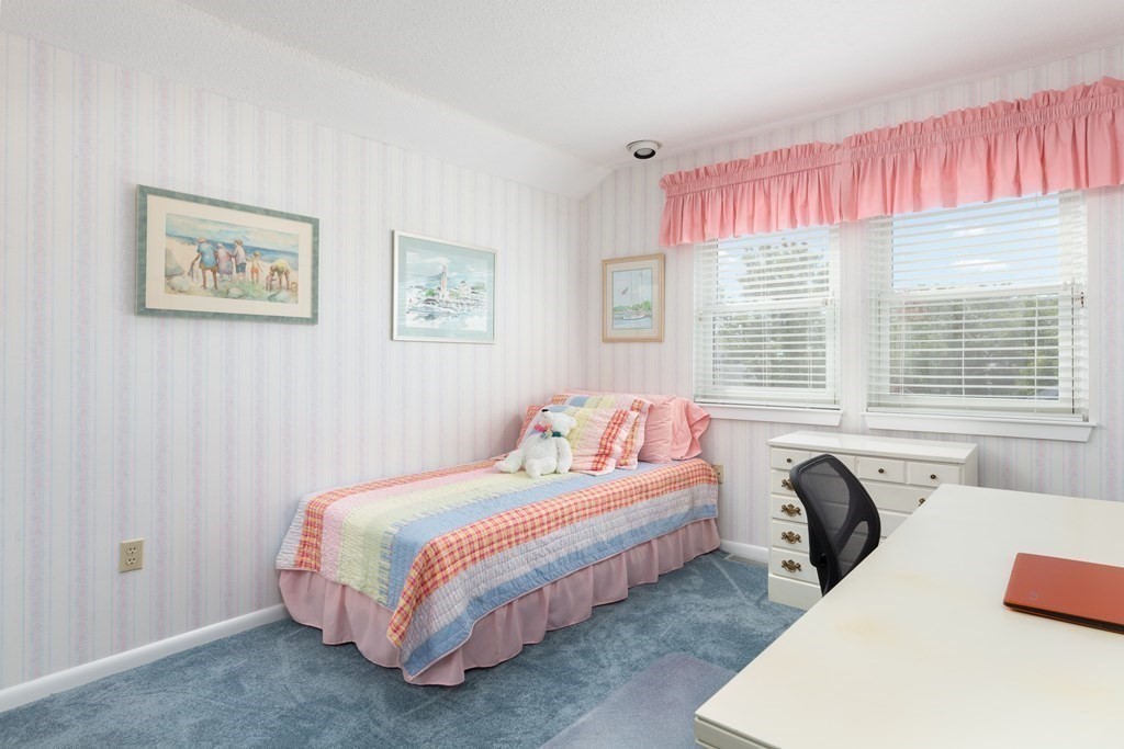 39 Harbourside Road, Unit 44 Quincy, MA 02171 - Photo 11 of 21 a bedroom with a bed and a large window