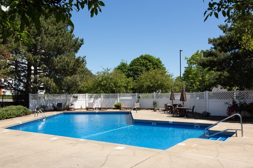 39 Harbourside Road, Unit 44 Quincy, MA 02171 - Photo 14 of 21 a view of a swimming pool with lounge chairs