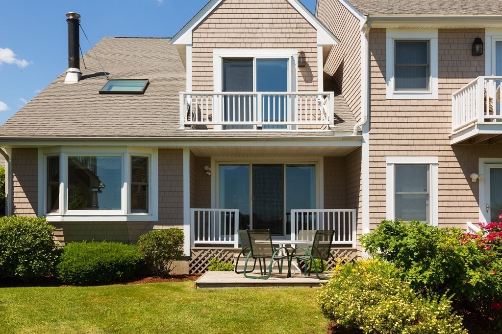 39 Harbourside Road, Unit 44 Quincy, MA 02171 - Photo 2 of 21 a view of a house with a small yard and plants