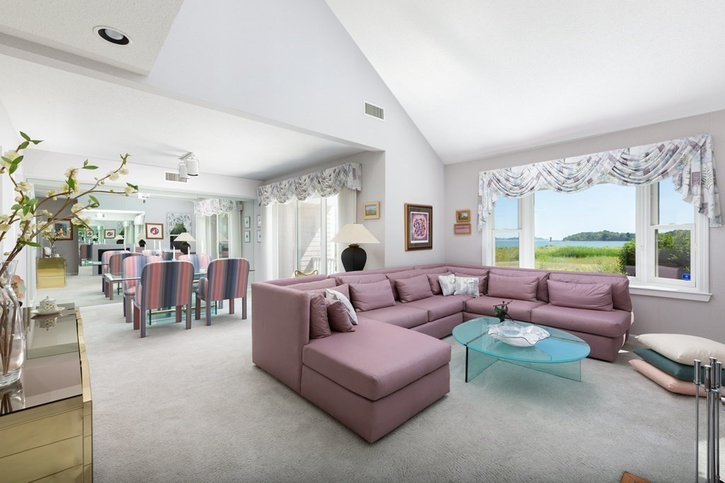 39 Harbourside Road, Unit 44 Quincy, MA 02171 - Photo 3 of 21 a living room with furniture and a large window