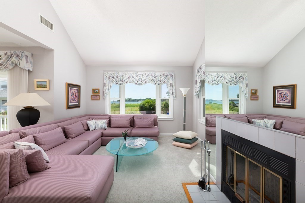 39 Harbourside Road, Unit 44 Quincy, MA 02171 - Photo 4 of 21 a living room with furniture and a large window