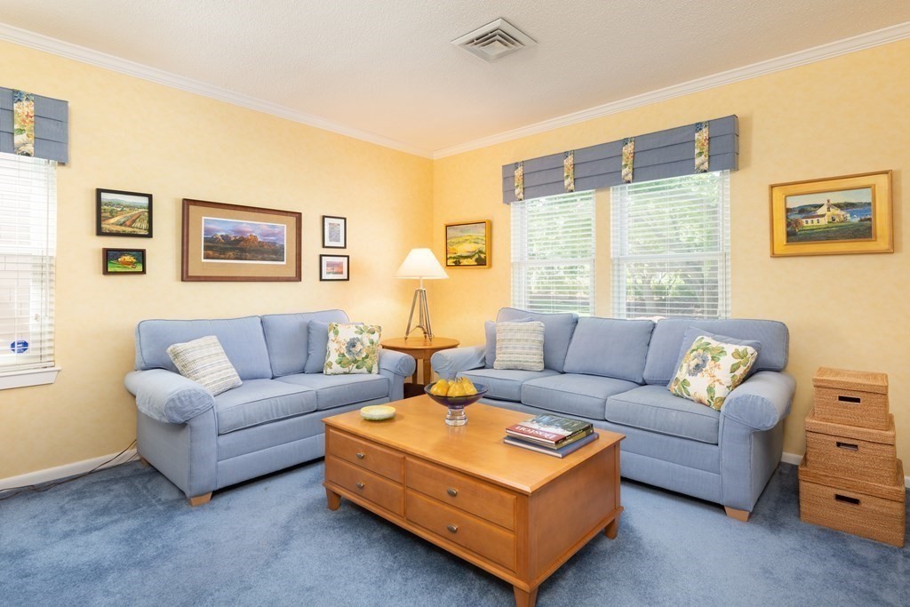 39 Harbourside Road, Unit 44 Quincy, MA 02171 - Photo 7 of 21 a living room with furniture and a large window