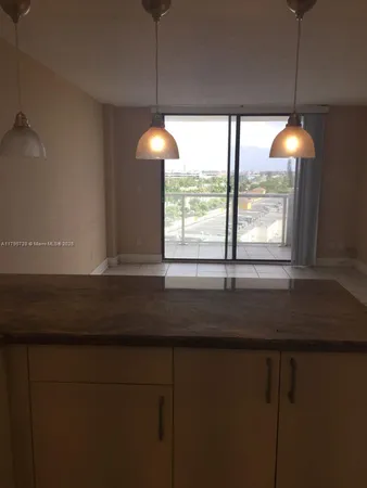 a kitchen with a sink and a window
