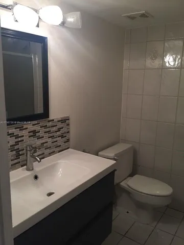 a lobby with furniture and potted plant