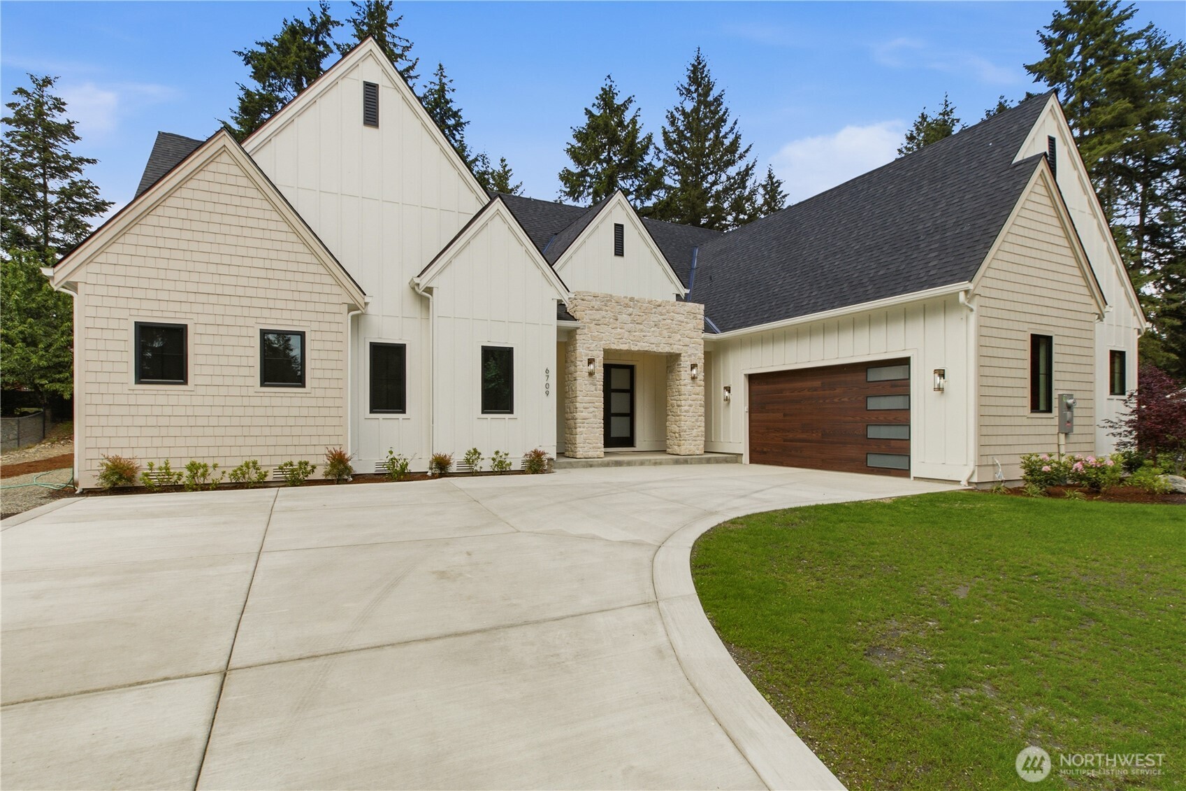 6709 254th Street East Graham, WA 98338 - Photo 3 of 40 a view of a house with a yard