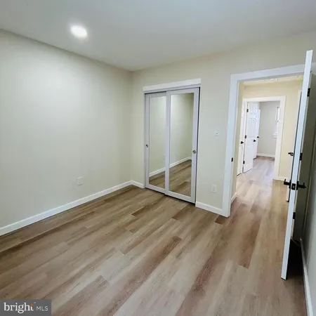 a bathroom with a toilet and a bathtub