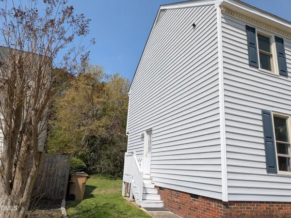 a balcony with table and chairs