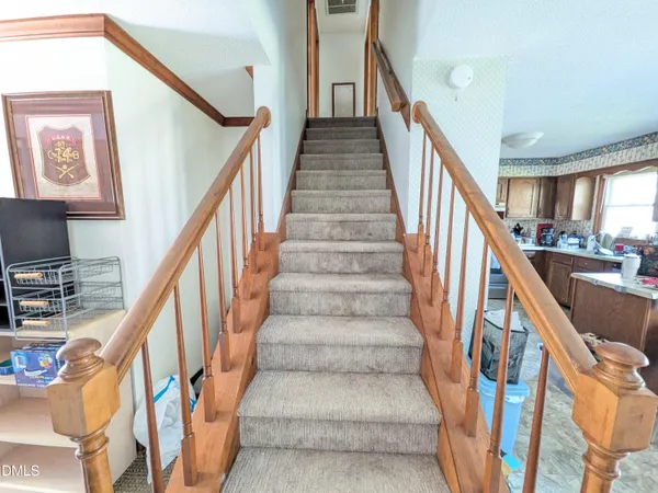 a kitchen with sink cabinets and window