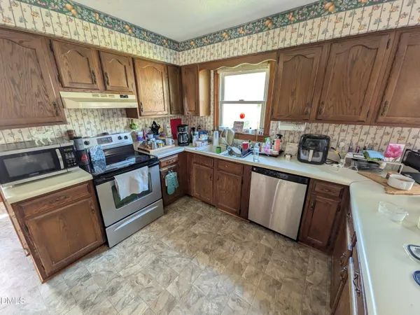 a bathroom with a sink mirror vanity and toilet