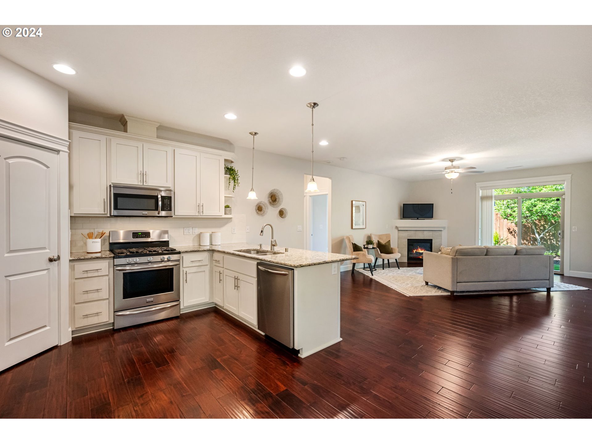 151 North 40th Avenue Ridgefield, WA 98642 - Photo 11 of 42 a kitchen with a refrigerator and a stove top oven