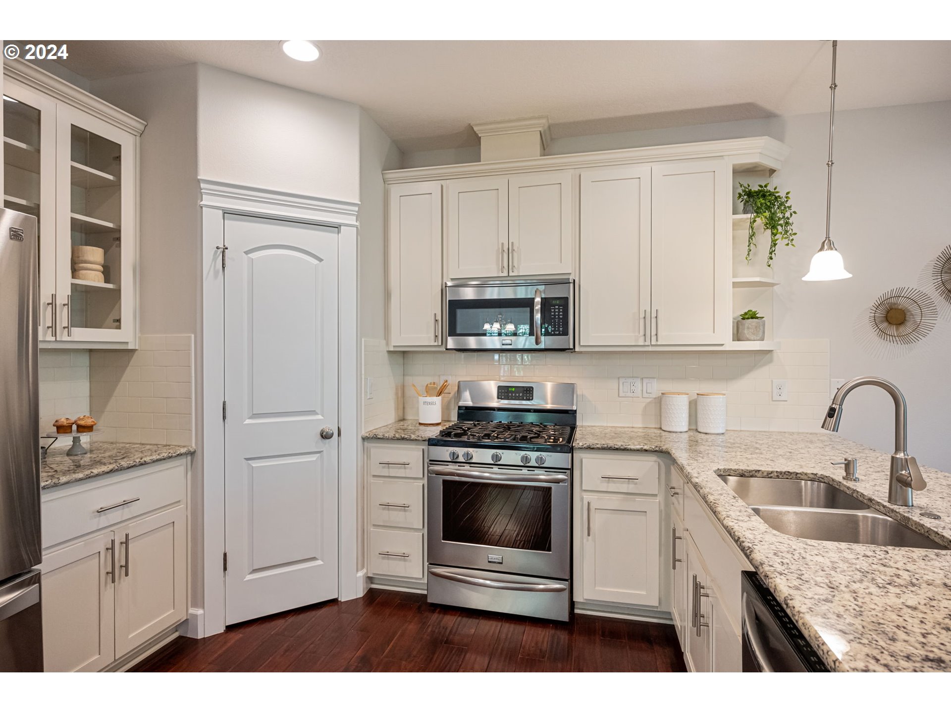 151 North 40th Avenue Ridgefield, WA 98642 - Photo 12 of 42 a kitchen with white cabinets and appliances