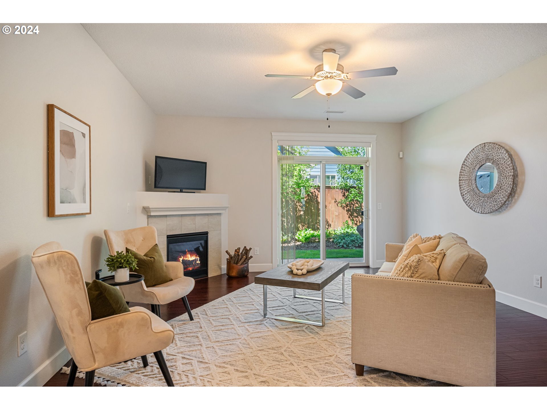 151 North 40th Avenue Ridgefield, WA 98642 - Photo 15 of 42 a living room with furniture a chandelier and a fireplace