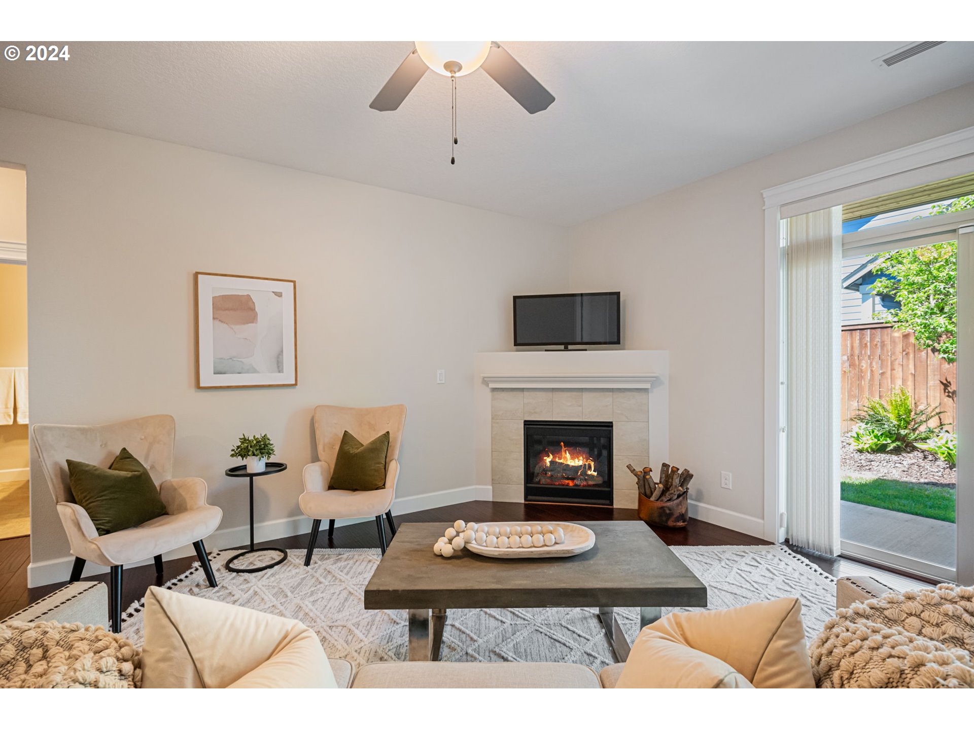 151 North 40th Avenue Ridgefield, WA 98642 - Photo 16 of 42 a living room with furniture a rug and a fireplace