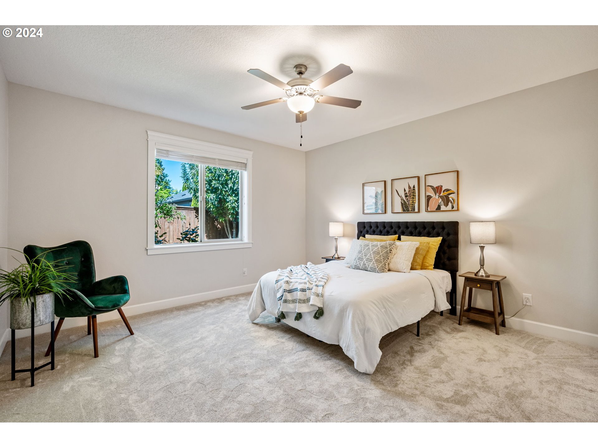 151 North 40th Avenue Ridgefield, WA 98642 - Photo 19 of 42 a bedroom with a bed and a chandelier