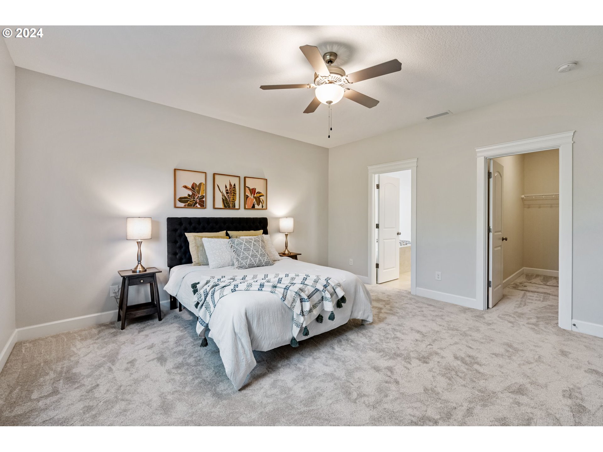 151 North 40th Avenue Ridgefield, WA 98642 - Photo 20 of 42 a bedroom with a bed and a chandelier
