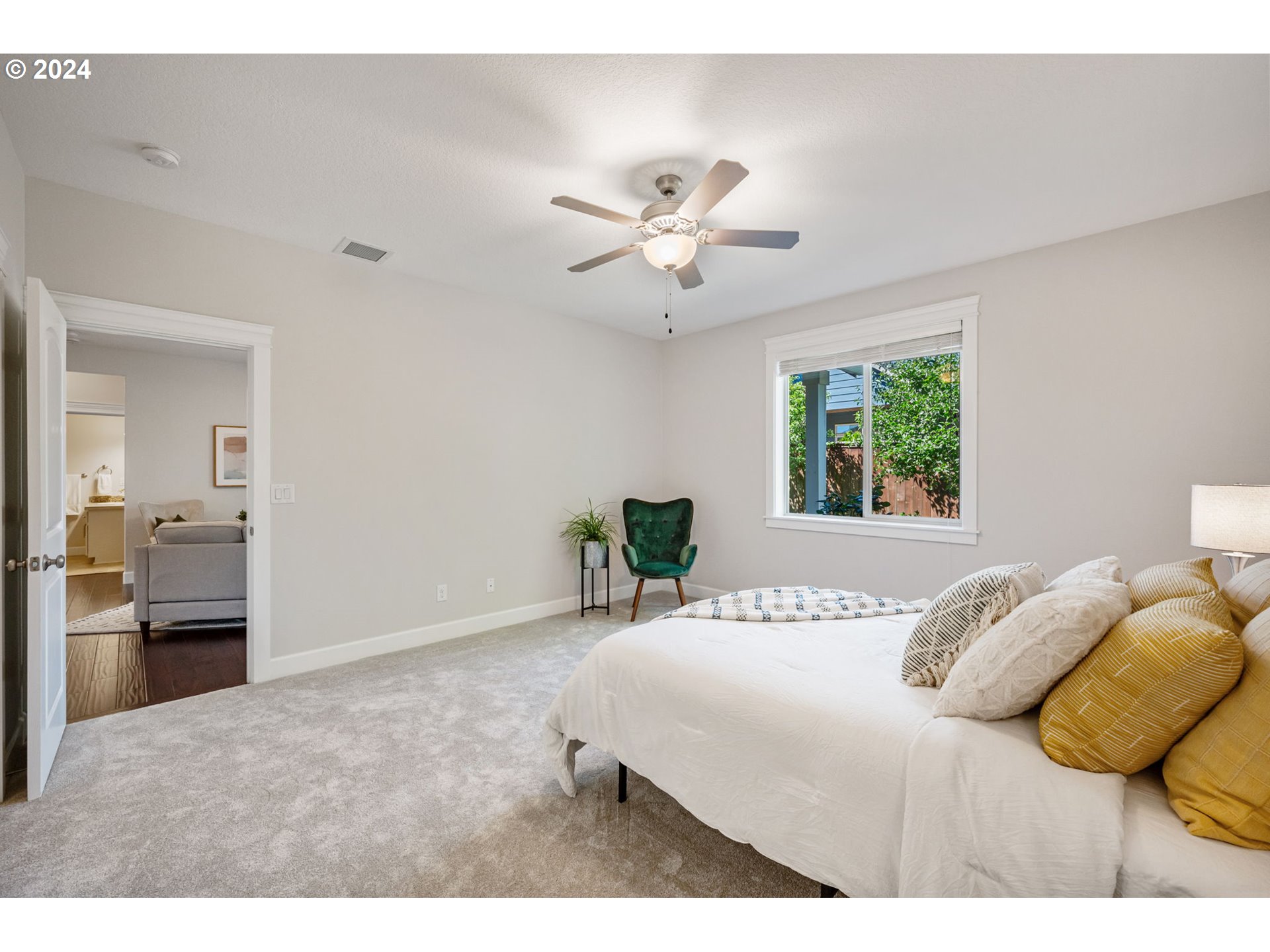 151 North 40th Avenue Ridgefield, WA 98642 - Photo 21 of 42 a bedroom with a bed and a chandelier