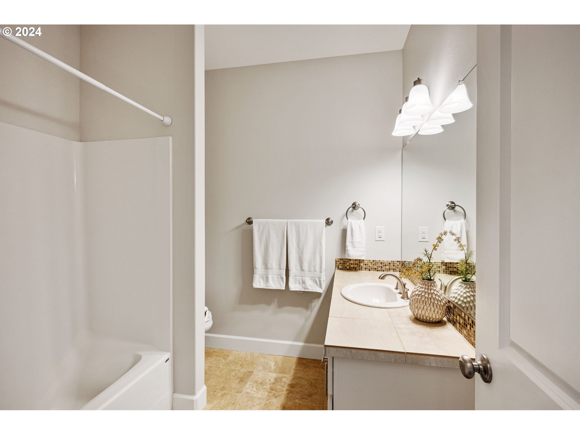 151 North 40th Avenue Ridgefield, WA 98642 - Photo 27 of 42 a bathroom with a sink vanity and a mirror