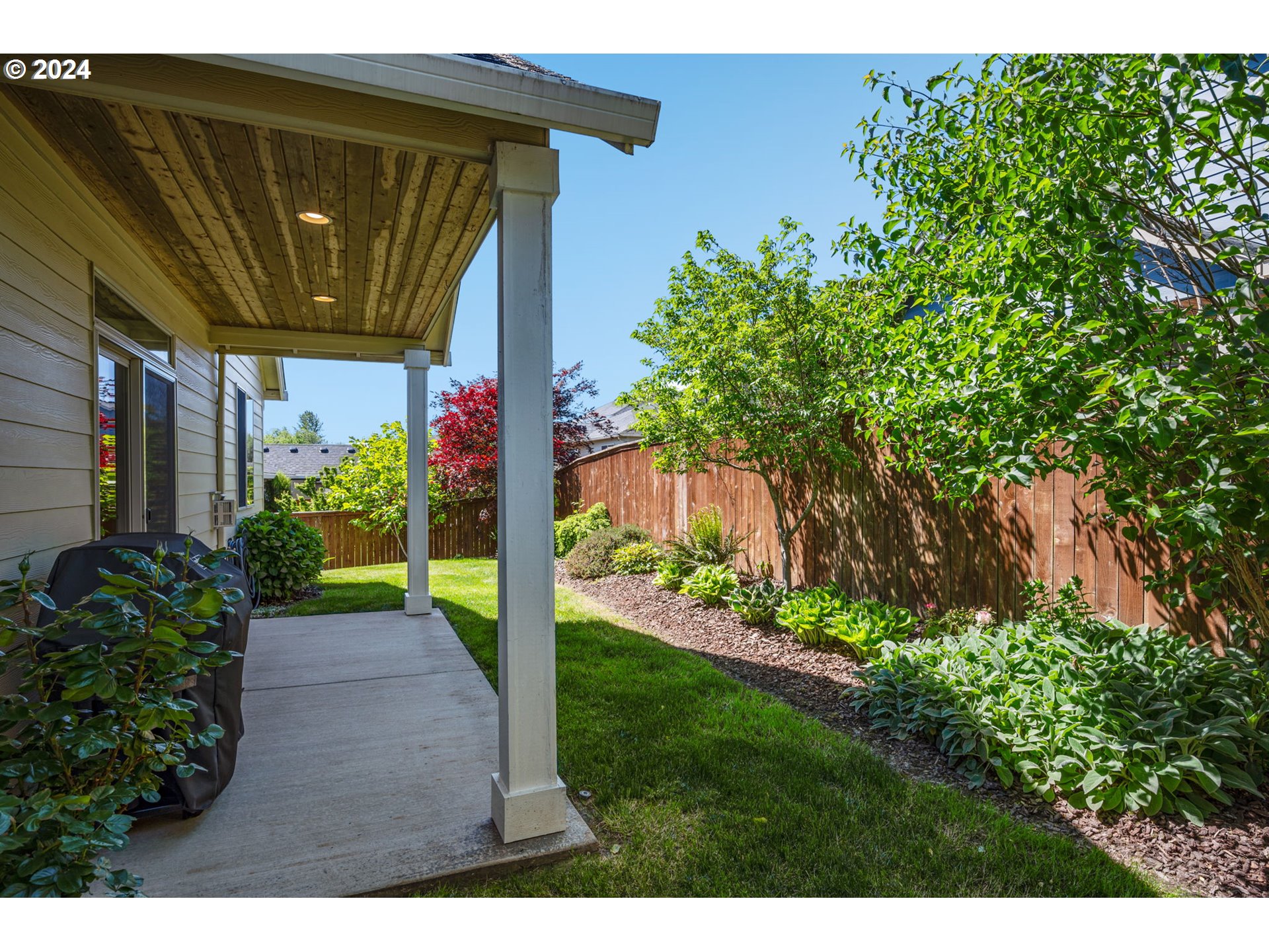 151 North 40th Avenue Ridgefield, WA 98642 - Photo 32 of 42 a view of a house with a flower garden