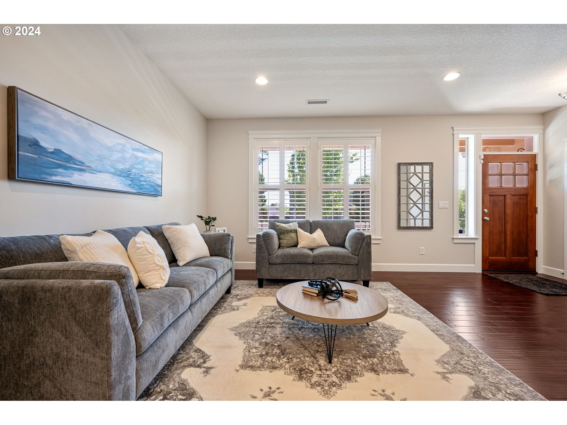 151 North 40th Avenue Ridgefield, WA 98642 - Photo 7 of 42 a living room with furniture couches and wooden floor