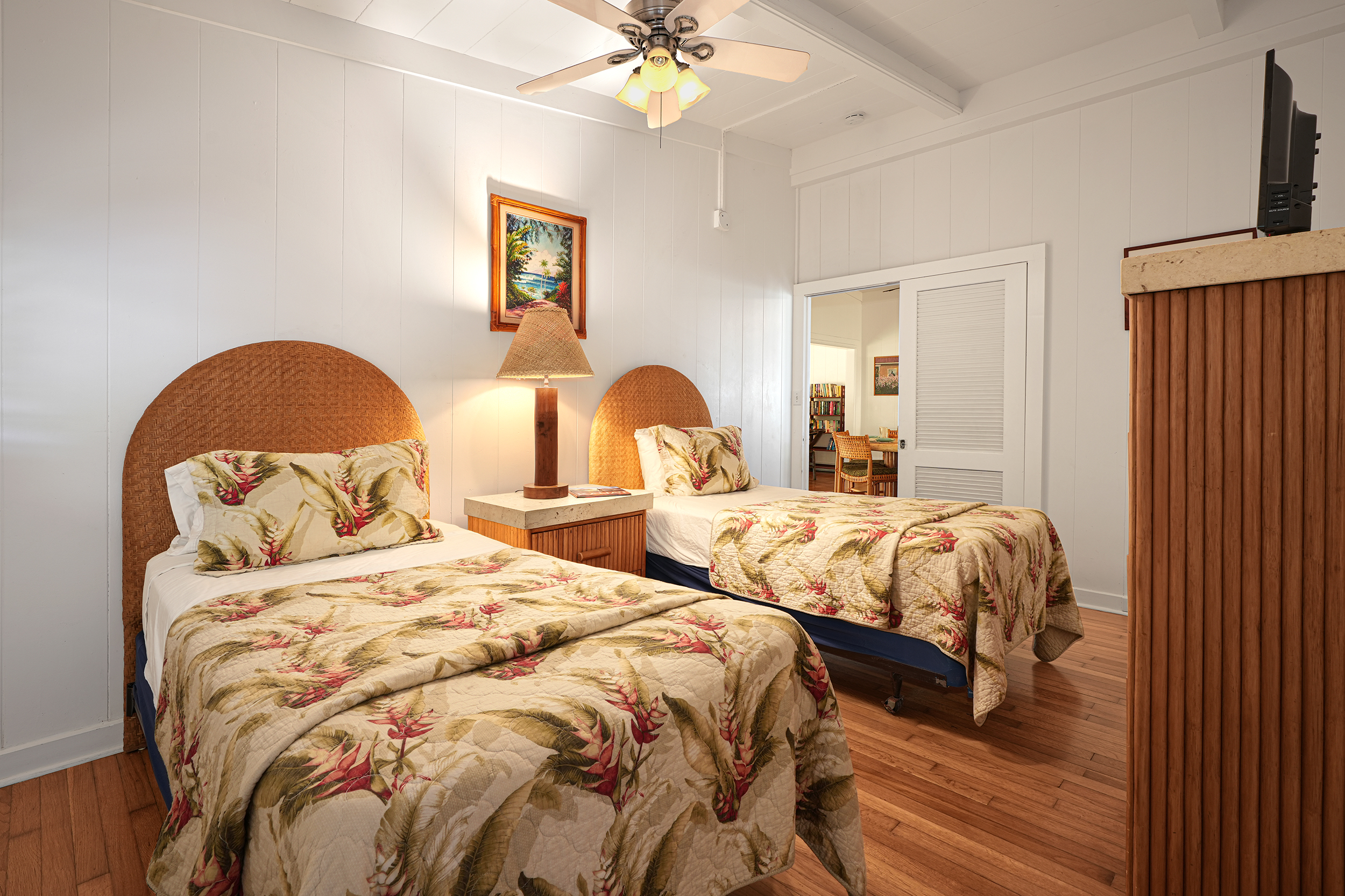 2261 Ho'ohu Road Koloa, HI 96756 - Photo 16 of 17 a bedroom with two beds and a chandelier