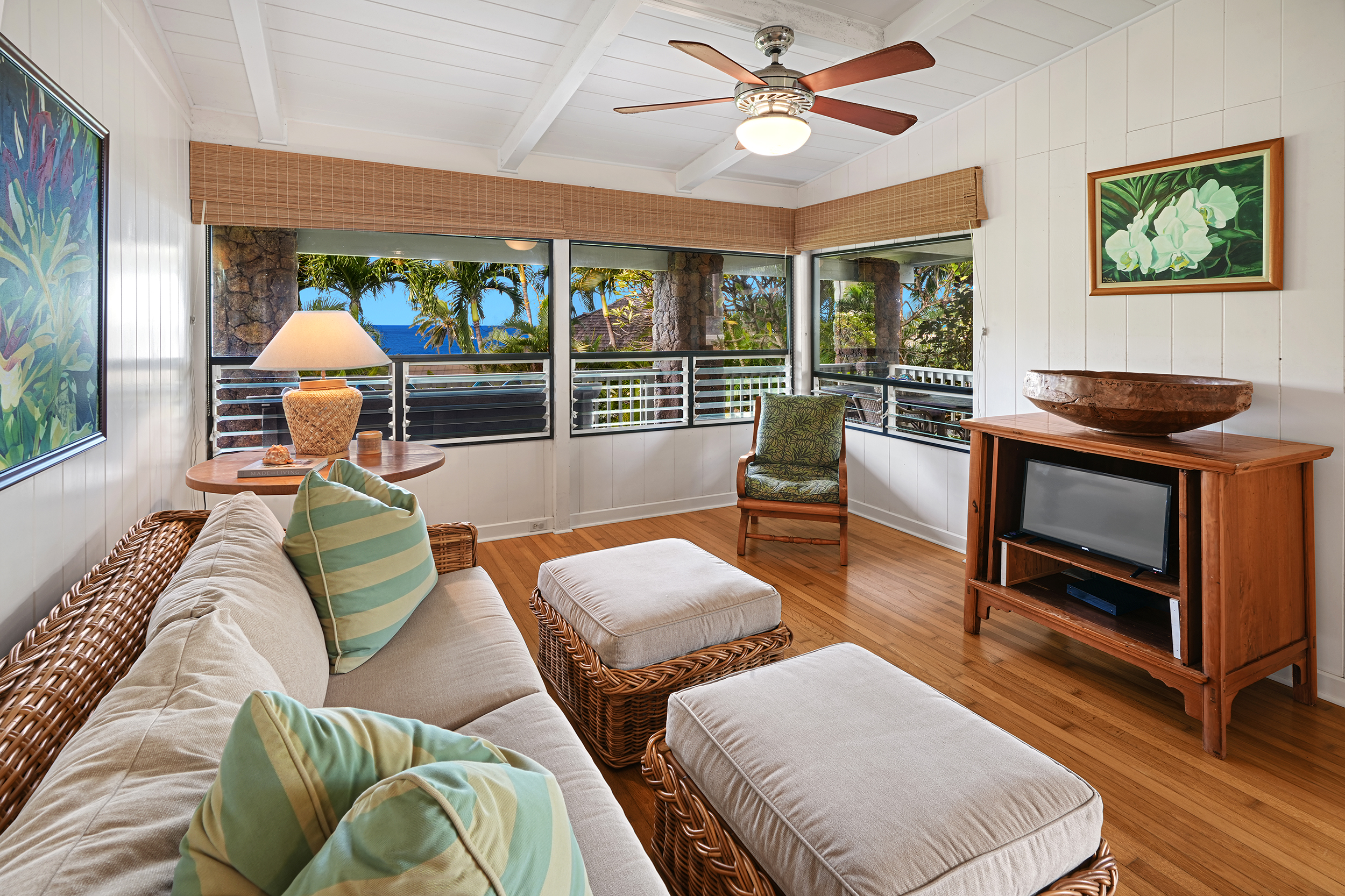 2261 Ho'ohu Road Koloa, HI 96756 - Photo 8 of 17 a living room with furniture fireplace and a large window