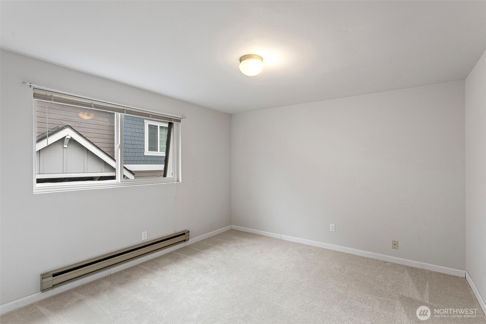 20714 76th Avenue West, Unit 11 Edmonds, WA 98026 - Photo 18 of 29 an empty room with a window