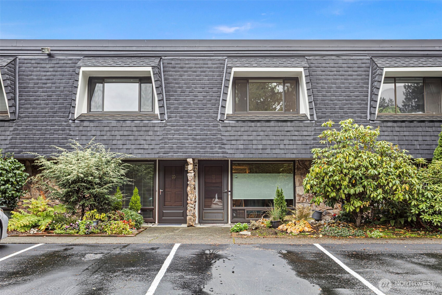 20714 76th Avenue West, Unit 11 Edmonds, WA 98026 - Photo 22 of 29 front view of a brick house with a small yard
