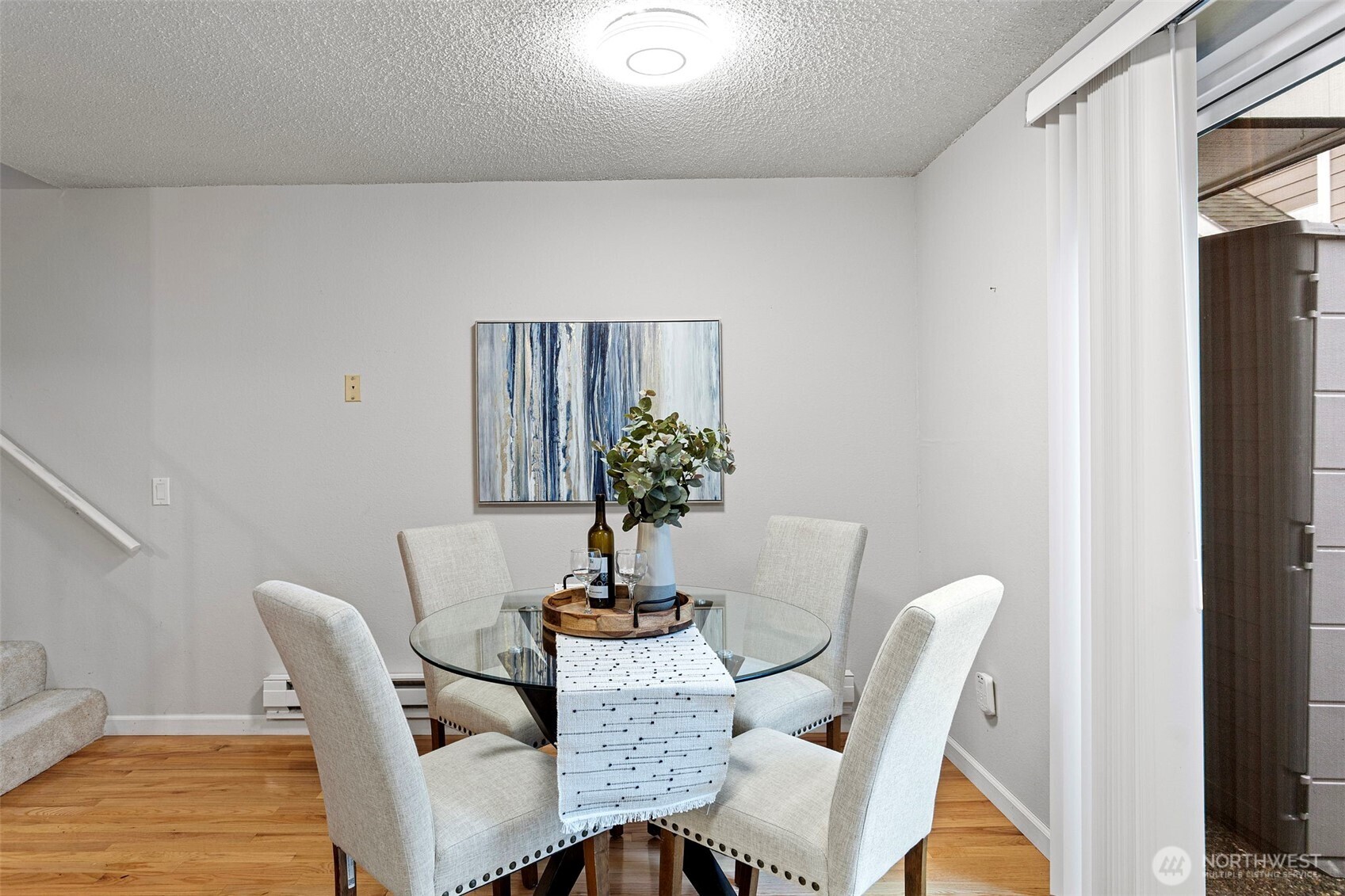 20714 76th Avenue West, Unit 11 Edmonds, WA 98026 - Photo 7 of 29 a view of a dining room with furniture and wooden floor