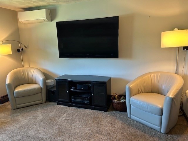 14 A Reed Street Londonderry, NH 03053 - Photo 15 of 39 a living room with furniture and a flat screen tv