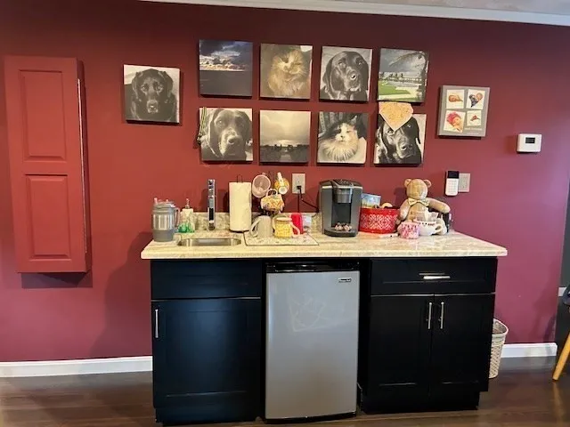 a room with painting and wooden floor