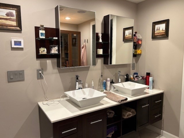 14 A Reed Street Londonderry, NH 03053 - Photo 20 of 39 a bathroom with a sink and a mirror