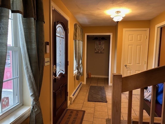 14 A Reed Street Londonderry, NH 03053 - Photo 2 of 39 a view of entry way with wooden door