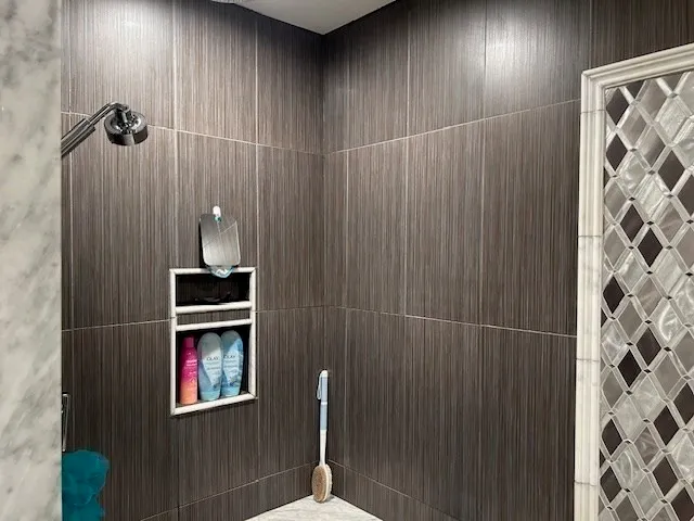 a bathroom with a shower and a sink