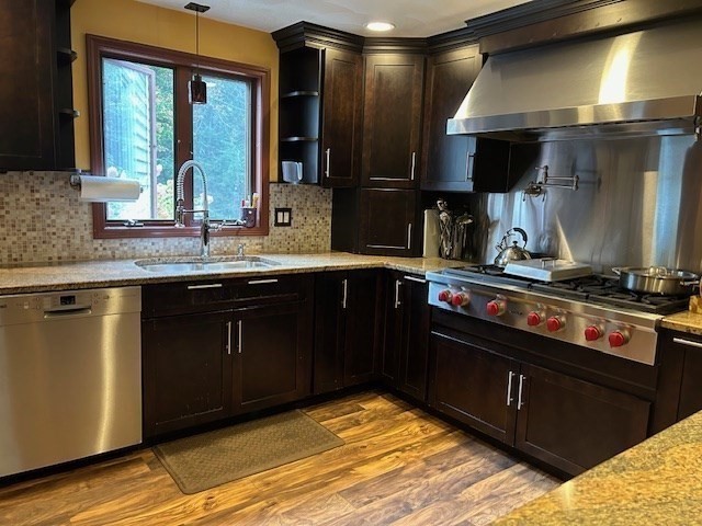 14 A Reed Street Londonderry, NH 03053 - Photo 3 of 39 a kitchen with a sink stove and cabinets