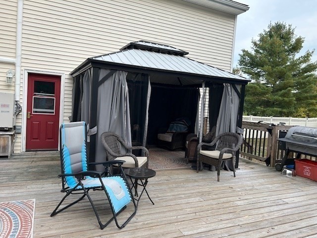 14 A Reed Street Londonderry, NH 03053 - Photo 31 of 39 a view of a dinning tables and chairs in patio of the house