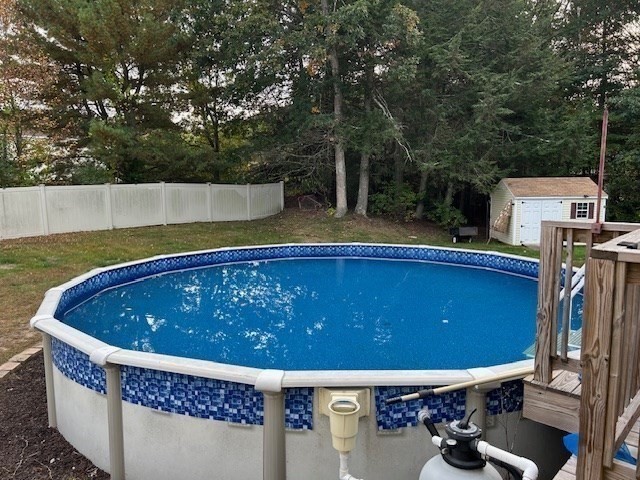 14 A Reed Street Londonderry, NH 03053 - Photo 32 of 39 a view of a chairs and table in the back yard