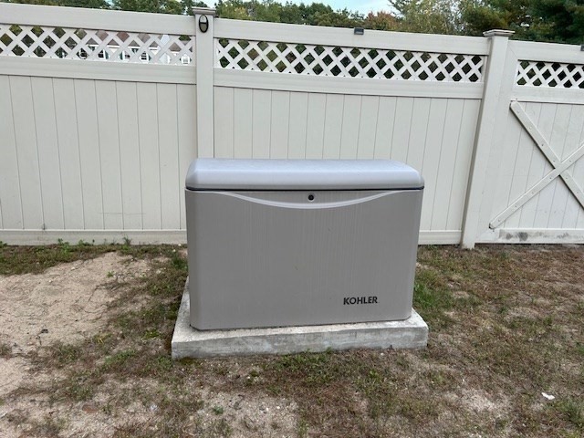 14 A Reed Street Londonderry, NH 03053 - Photo 33 of 39 a view of a utility room with dryer and stairs